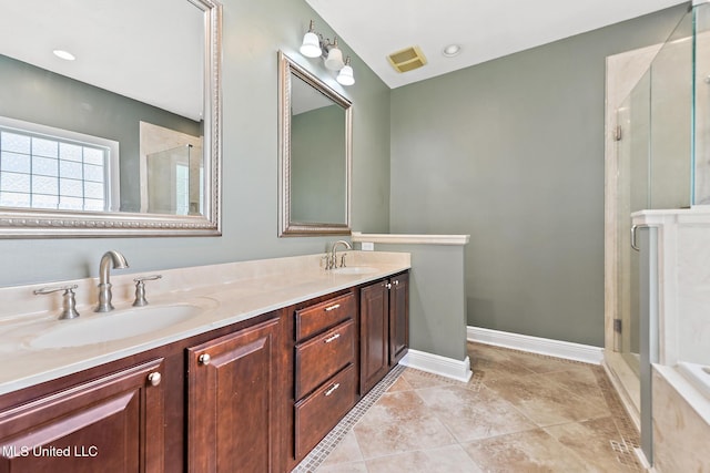 10566 W River Vue, Biloxi, MS 39532 - bathroom featuring double vanity and a shower with door