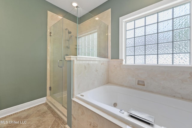 10566 W River Vue, Biloxi, MS 39532 - bathroom with a shower stall, a jetted tub, and tile patterned flooring
