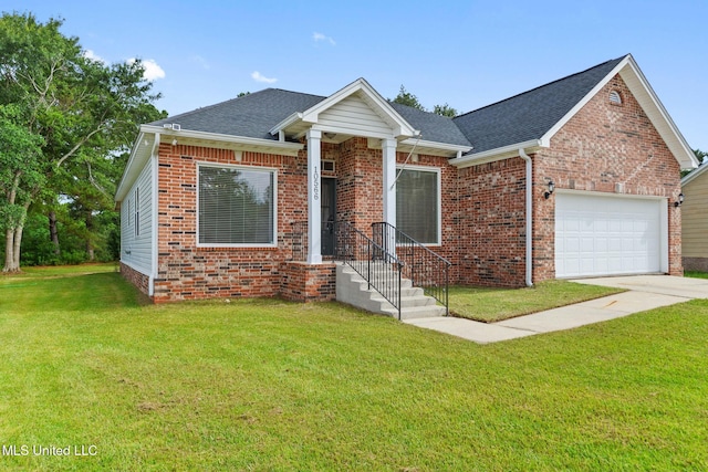 10566 W River Vue, Biloxi, MS 39532 - view of front of property with a garage, brick siding, a front lawn, a shingled roof, and concrete driveway