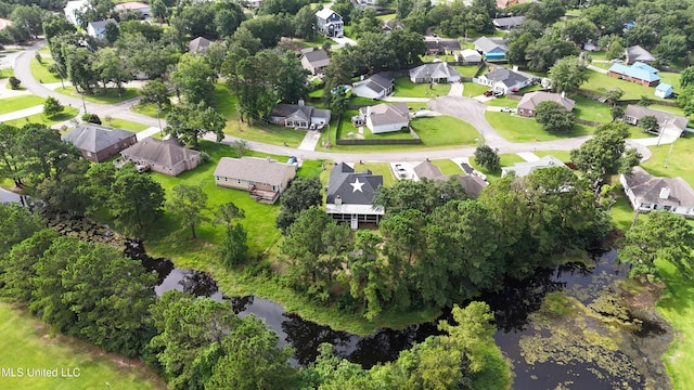 10566 W River Vue, Biloxi, MS 39532 - aerial view of property and surrounding area with nearby suburban area and a large body of water