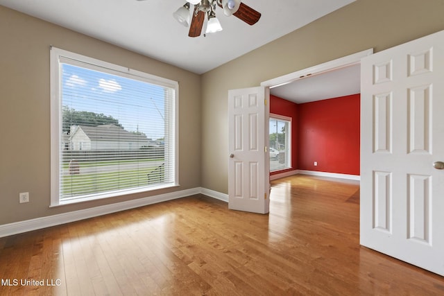 10566 W River Vue, Biloxi, MS 39532 - empty room with light wood-type flooring and a ceiling fan