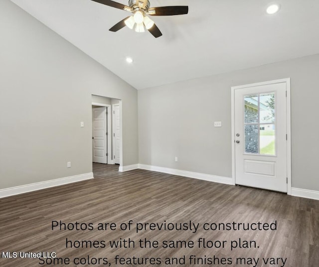 interior space featuring ceiling fan, dark wood-type flooring, and vaulted ceiling