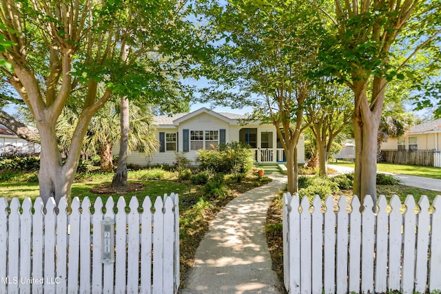 211 Demontluzin Ave, Bay Saint Louis, MS 39520 - ranch-style house featuring covered porch