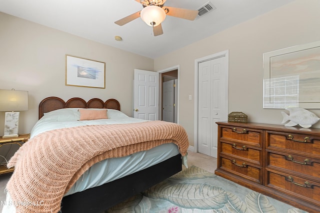 211 Demontluzin Ave, Bay Saint Louis, MS 39520 - bedroom with light carpet, a closet, and a ceiling fan