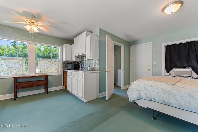 211 Demontluzin Ave, Bay Saint Louis, MS 39520 - bedroom featuring baseboards, cooling unit, and a ceiling fan