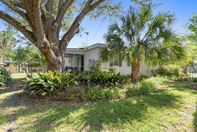 211 Demontluzin Ave, Bay Saint Louis, MS 39520 - view of front of property with a front lawn
