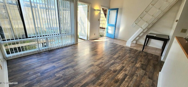 unfurnished living room with hardwood / wood-style flooring