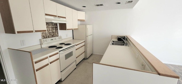 kitchen featuring white cabinetry, white appliances, sink, and a textured ceiling