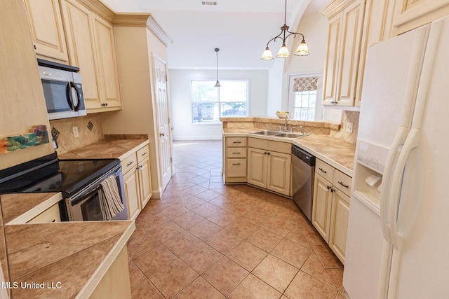 kitchen with decorative backsplash, a sink, light countertops, stainless steel appliances, and light tile patterned flooring