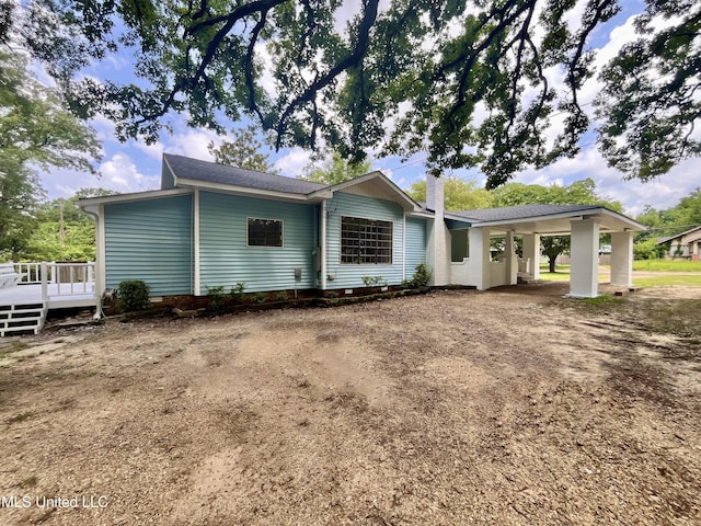 708 Lee Ave, Crystal Springs, MS 39059 - view of front of house with a deck, a chimney, and driveway