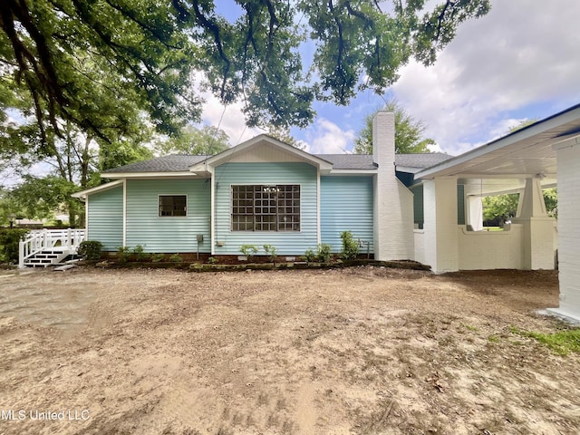 708 Lee Ave, Crystal Springs, MS 39059 - view of front of home with a chimney and a shingled roof