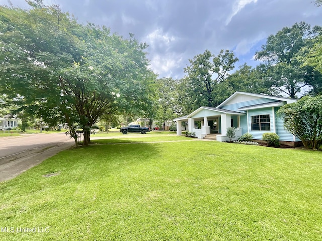 708 Lee Ave, Crystal Springs, MS 39059 - view of green lawn with covered porch