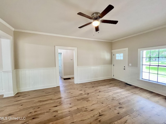708 Lee Ave, Crystal Springs, MS 39059 - foyer entrance with wood finished floors, ornamental molding, wainscoting, and ceiling fan