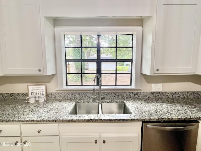 708 Lee Ave, Crystal Springs, MS 39059 - kitchen with dishwasher, white cabinetry, and light stone countertops
