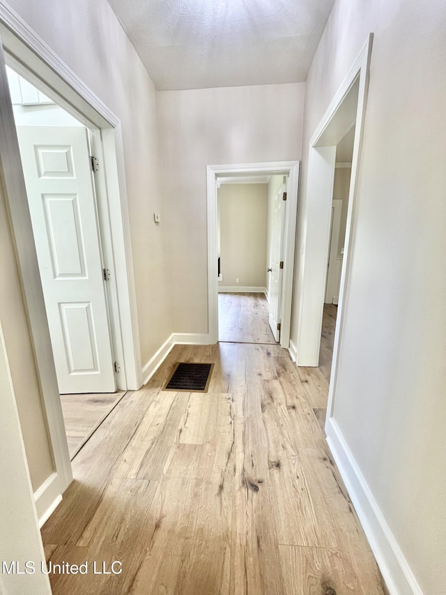 708 Lee Ave, Crystal Springs, MS 39059 - corridor with wood finished floors and baseboards