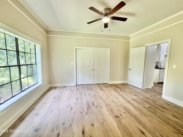 708 Lee Ave, Crystal Springs, MS 39059 - unfurnished bedroom featuring crown molding, light wood-type flooring, a closet, and a ceiling fan
