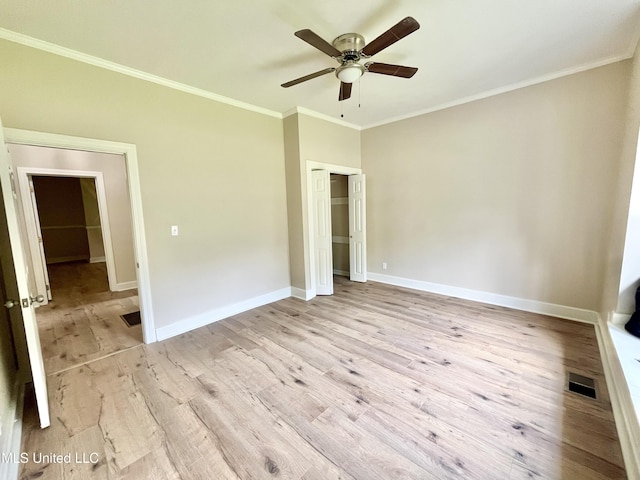 708 Lee Ave, Crystal Springs, MS 39059 - unfurnished bedroom featuring crown molding, light wood-style floors, a closet, and ceiling fan
