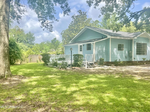 708 Lee Ave, Crystal Springs, MS 39059 - rear view of house featuring a lawn