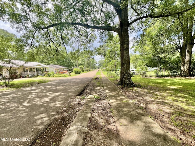708 Lee Ave, Crystal Springs, MS 39059 - view of asphalt street featuring sidewalks