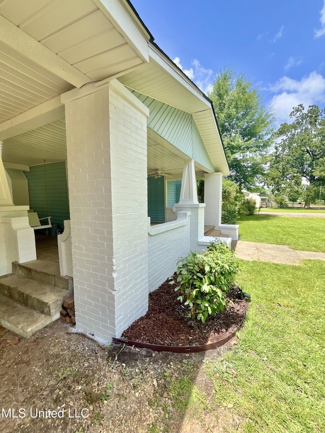 708 Lee Ave, Crystal Springs, MS 39059 - view of home's exterior featuring a lawn and brick siding