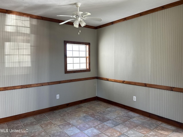 spare room with ceiling fan