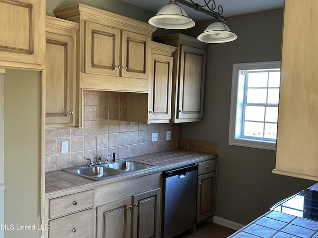 kitchen with decorative backsplash, tile countertops, stainless steel dishwasher, and sink