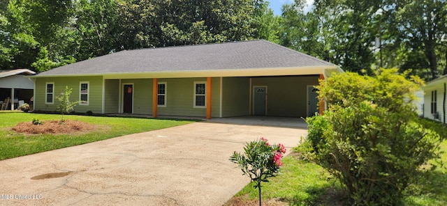 233 Allstate Dr, Jackson, MS 39211 - ranch-style house with driveway, a front lawn, and an attached carport