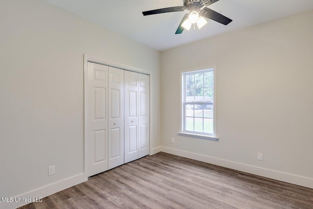 233 Allstate Dr, Jackson, MS 39211 - unfurnished bedroom with wood finished floors, a closet, and a ceiling fan