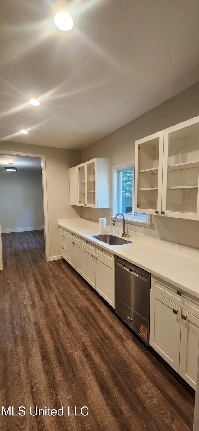 233 Allstate Dr, Jackson, MS 39211 - kitchen with dishwasher, dark wood finished floors, white cabinetry, glass insert cabinets, and light countertops
