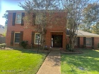 view of front of house with a front lawn