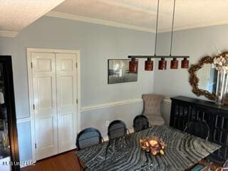 living area featuring crown molding and dark hardwood / wood-style flooring