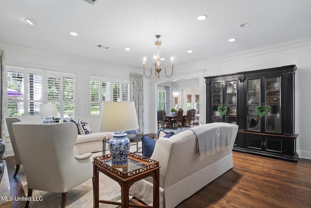 living room featuring visible vents, crown molding, wood finished floors, a chandelier, and recessed lighting