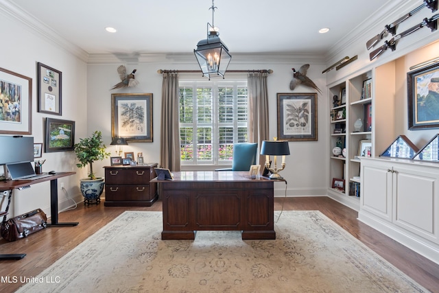 office space featuring crown molding, baseboards, built in features, and dark wood-type flooring
