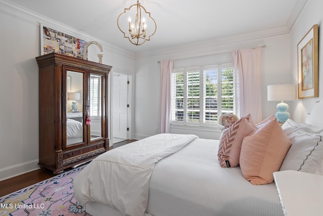 bedroom featuring baseboards, a chandelier, ornamental molding, and wood finished floors
