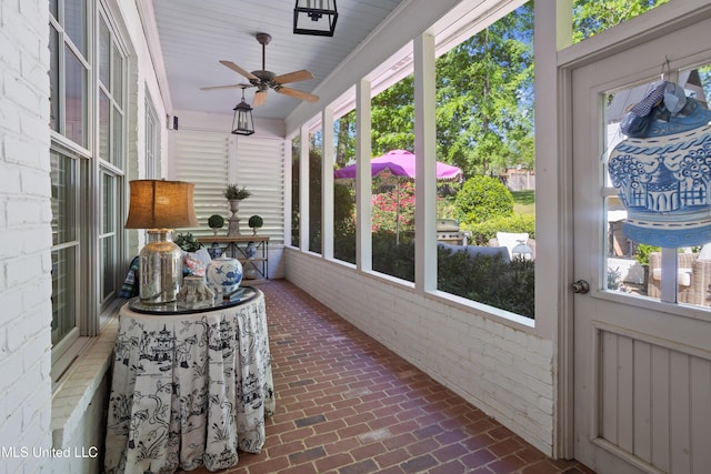 sunroom / solarium with ceiling fan