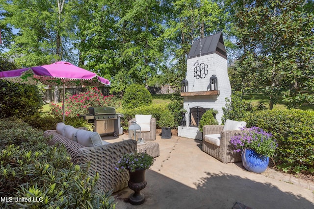 view of patio with outdoor lounge area and a grill