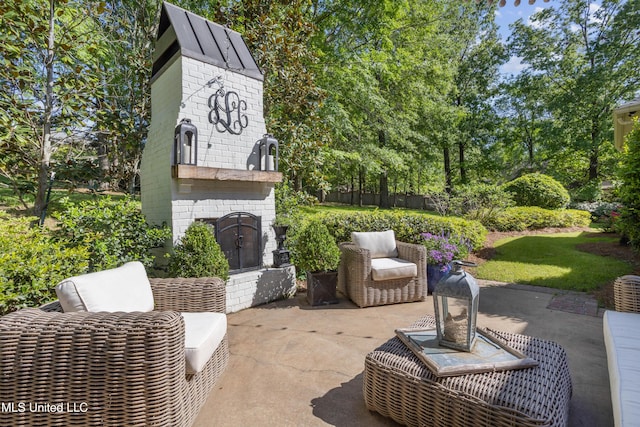 view of patio with an outdoor brick fireplace