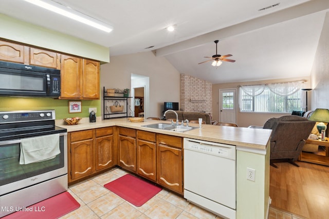 6944 Apona St, Diamondhead, MS 39525 - kitchen featuring black microwave, dishwasher, stainless steel range with electric cooktop, a sink, and a peninsula