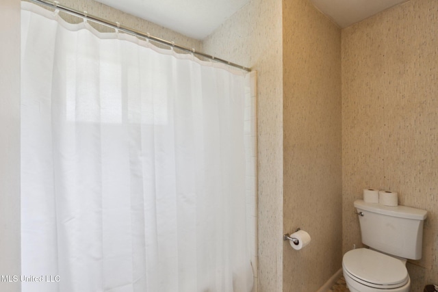 6944 Apona St, Diamondhead, MS 39525 - bathroom featuring toilet and a shower with curtain