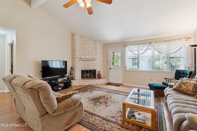 6944 Apona St, Diamondhead, MS 39525 - living area with a ceiling fan, light wood-style floors, and a brick fireplace