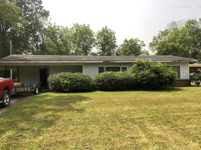 ranch-style home with a front lawn