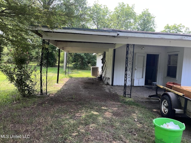 exterior space featuring a carport