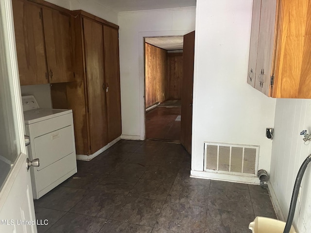 laundry room with cabinets and washer / dryer