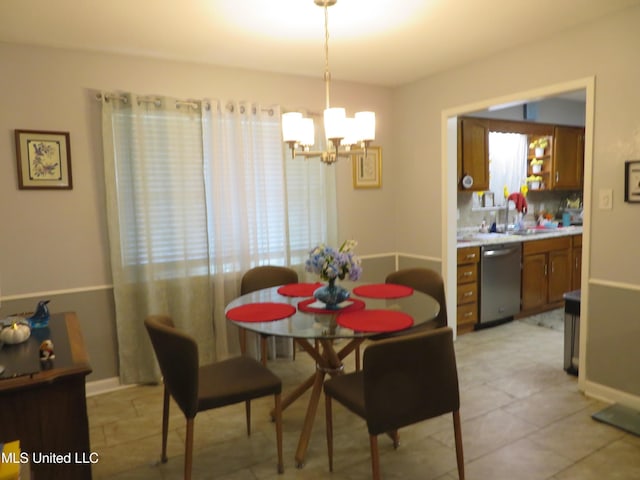 dining area featuring baseboards and a notable chandelier