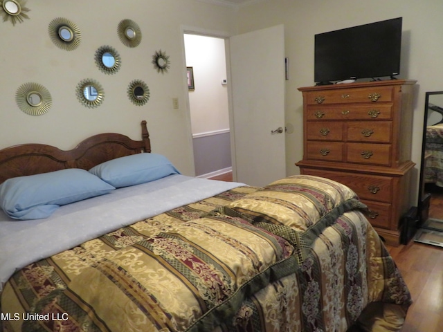 bedroom featuring wood finished floors