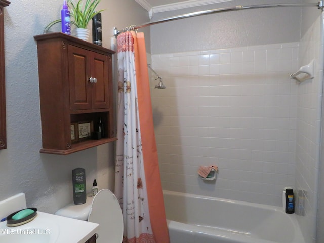 full bath featuring toilet, shower / bath combo, ornamental molding, vanity, and a textured wall