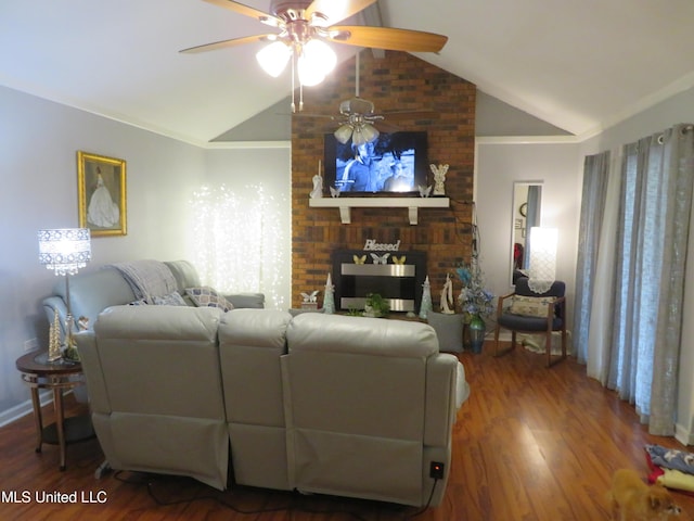 living area featuring a fireplace, wood finished floors, ceiling fan, and vaulted ceiling