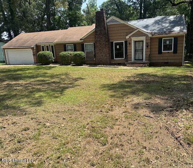 3916 Oakhill Dr, Jackson, MS 39206 - ranch-style house featuring an attached garage, a chimney, a front yard, and crawl space