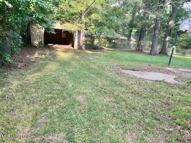 3916 Oakhill Dr, Jackson, MS 39206 - view of green lawn with an outbuilding
