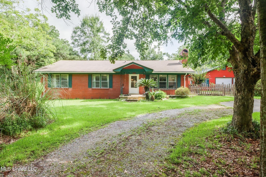 8474 Woolmarket Rd, Biloxi, MS 39532 - ranch-style home with driveway, brick siding, a chimney, and a garage